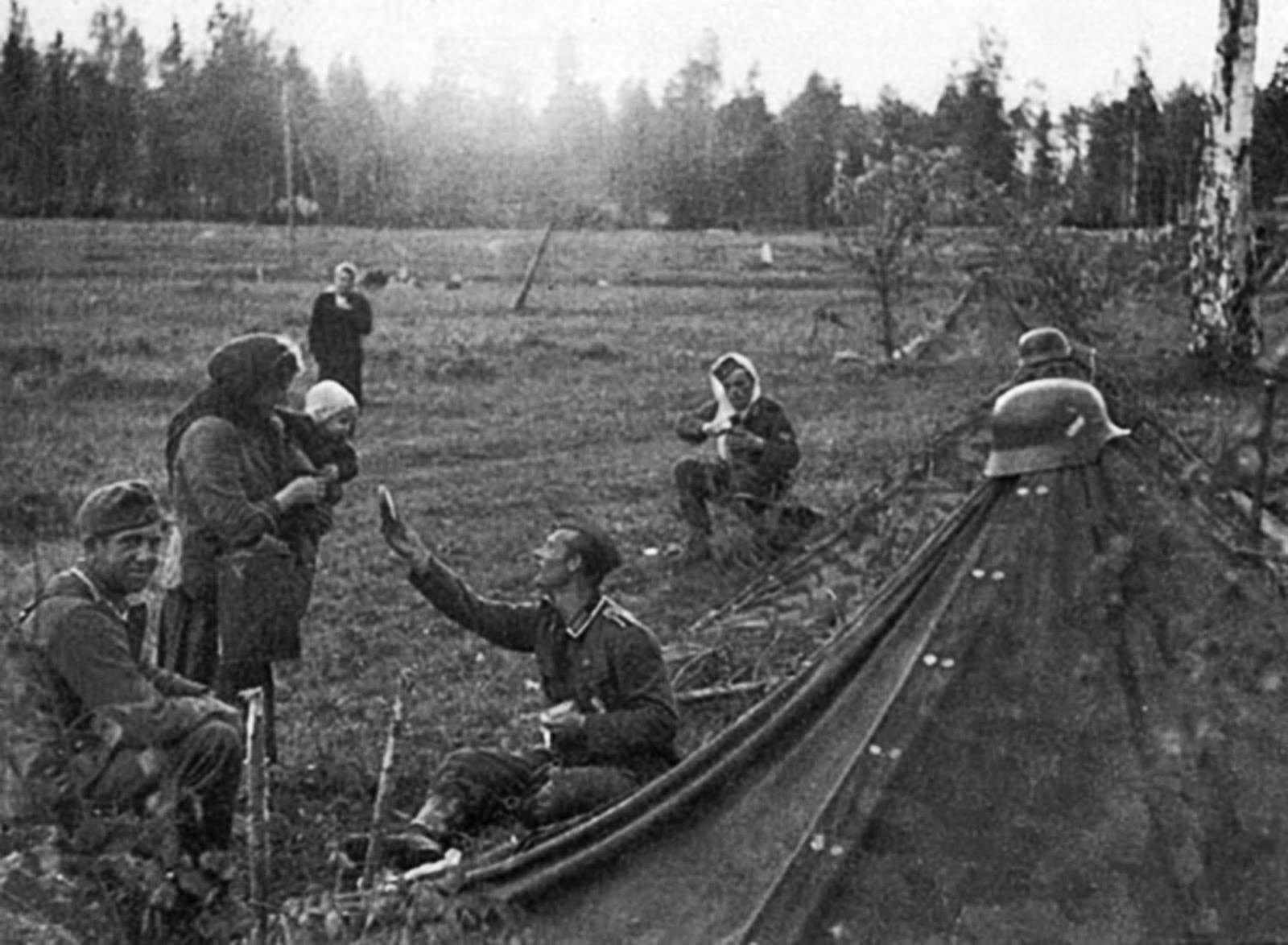 A German soldier shares his rations with a Russian mother, 1941