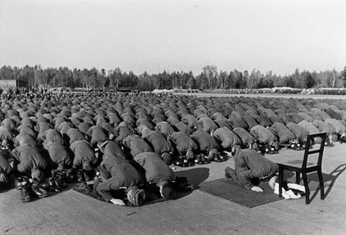 Muslim members of the Waffen-SS 13th division at prayer during their training in Germany,  1943
