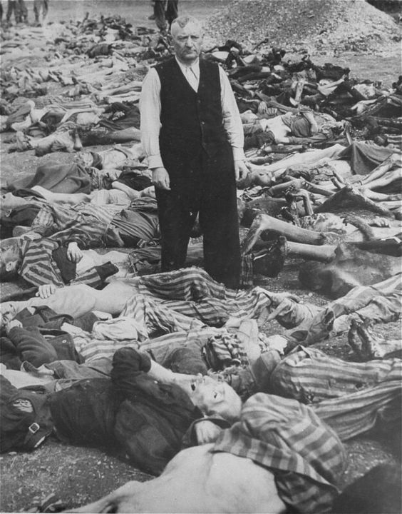 ss-officer-johann-baptist-eichelsdoerfer-the-commandant-of-the-kaufering-iv-concentration-camp-hurlach-bavaria-germany-stands-among-the-corpses-of-prisoners-killed-in-his-camp-dat