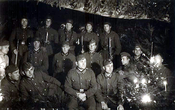 german-soldiers-gathered-around-a-glowing-christmas-tree-on-early-world-war-ii-christmas-eve