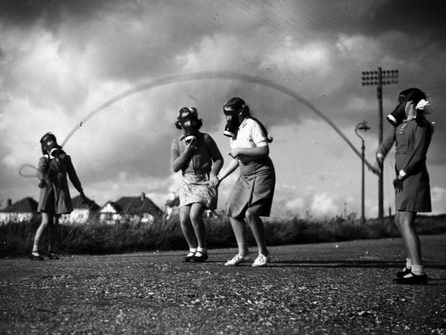 girls-wearing-gas-masks-playing