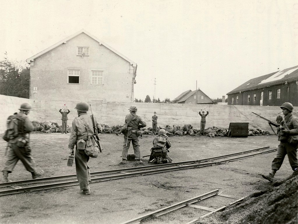 1024px-Dachau_execution_coalyard_1945-04-29