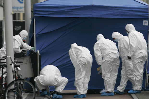 Police forensic experts search for clues